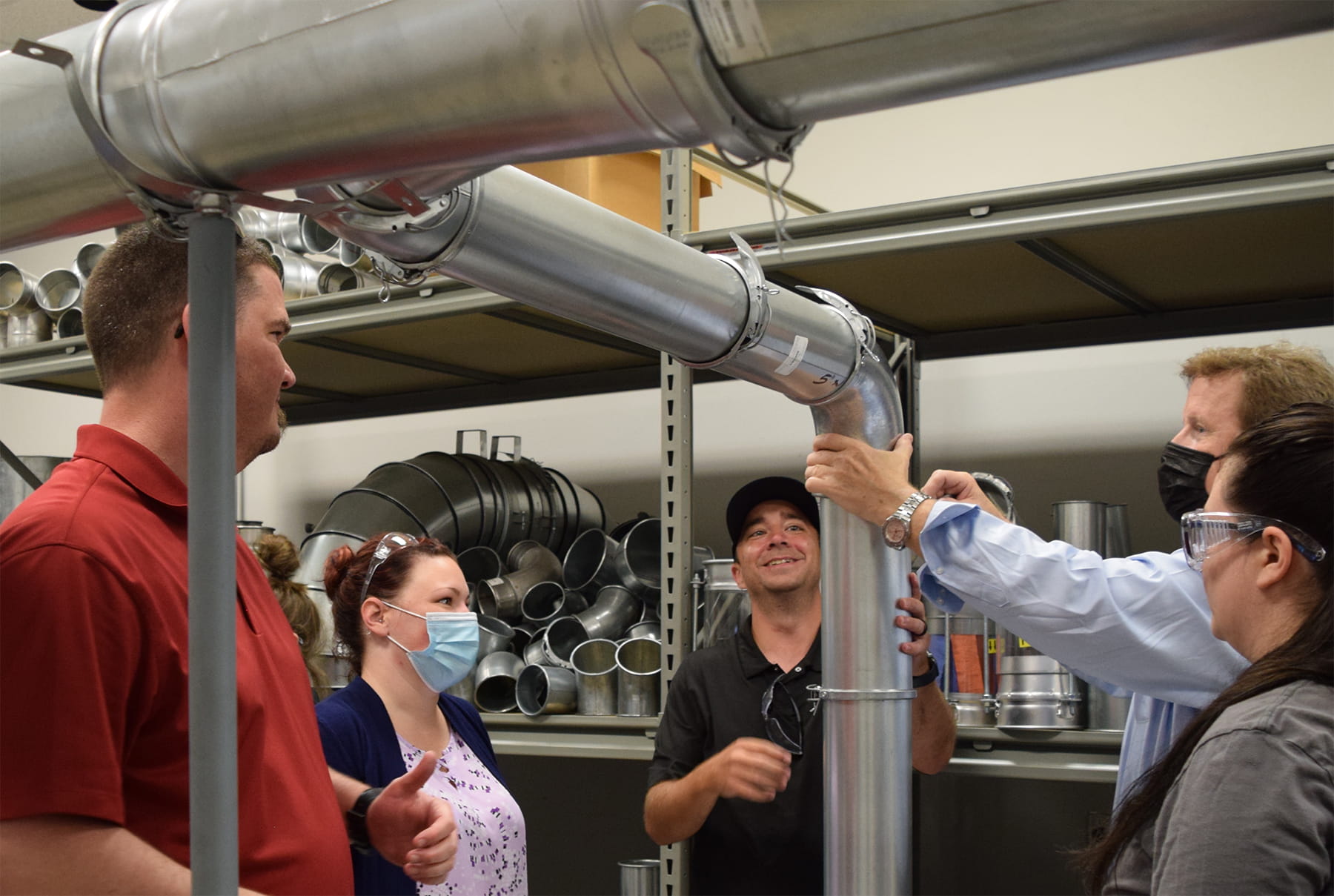 Nordfab University attendees building a practice ductwork installation